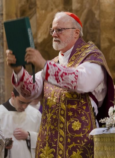 U.S. Cardinal Sean Patrick O'Malley hoists a book of prayers as he celebrates Mass in his titular church of Santa Maria alla Vittoria in Rome, Sunday, March 10, 2013. Cardinals from around the world gather this week in a conclave to elect a new pope following the stunning resignation of Benedict XVI. In the secretive world of the Vatican, there is no way to know who is in the running, and history has yielded plenty of surprises. Yet several names have come up time repeatedly as strong contenders for the job. O'Malley, the archbishop of Boston, is among those considered to have a credible shot at the papacy. (Domenico Stinellis / Associated Press)