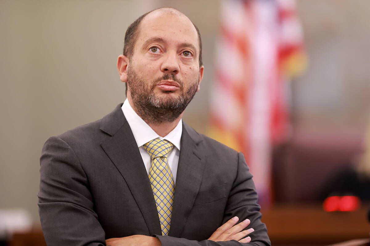 Chief Deputy District Attorney Christopher Hamner presents evidence to Matthew Hovanec, a Metropolitan Police Department digital forensics lab supervisor, while Hovanec testifies on the witness stand on the 10th day of the murder trial for Robert Telles at the Regional Justice Center in Las Vegas Friday, Aug. 23, 2024. Telles, a former Clark County public administrator, is charged in the murder of Las Vegas Review-Journal investigative journalist Jeff German.   (K.M. Cannon/Las Vegas Review-Journal/TNS)