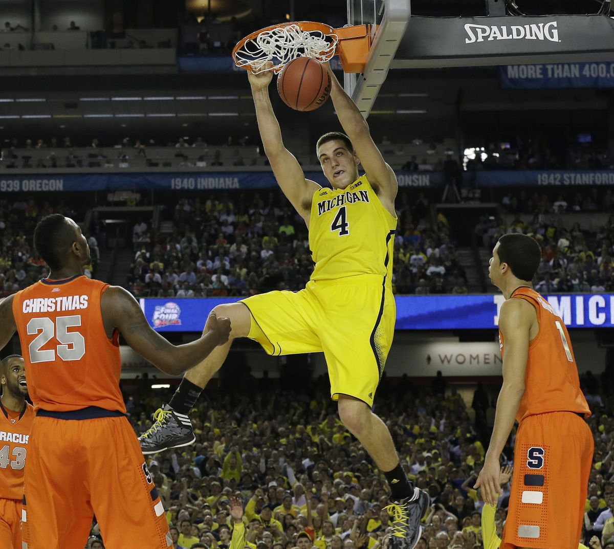 Mitch McGary, one of Michigan’s freshman stars, dunks the ball against Syracuse during the second half of the Wolverines’ 61-56 victory. (Associated Press)