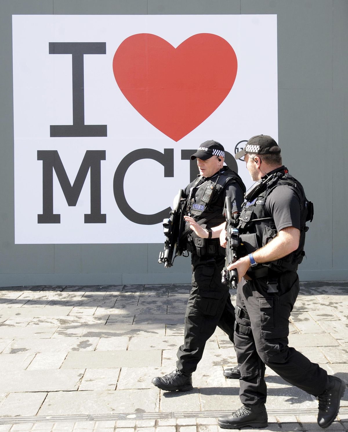 Armed response police patrol the streets in central Manchester, England, Saturday, May 27, 2017. More than 20 people were killed in an explosion following an Ariana Grande concert at the Manchester Arena late Monday evening. (Rui Vieira / Associated Press)