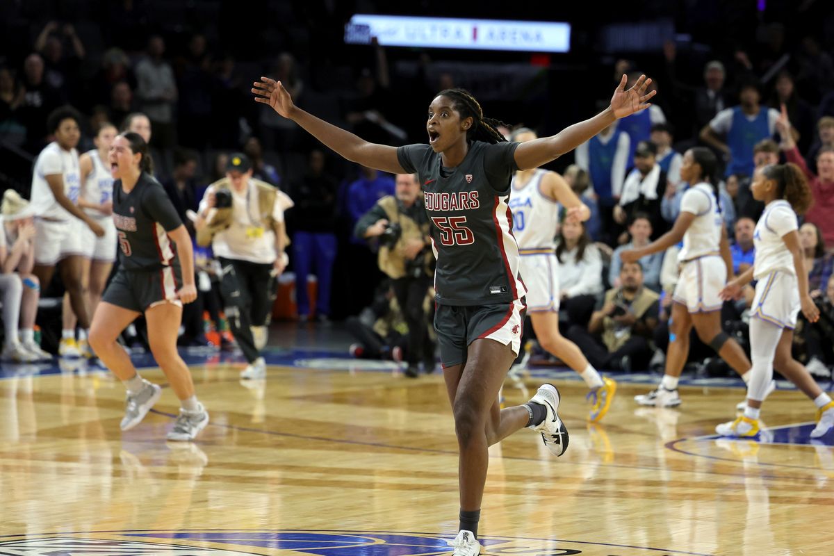 Washington State’s Bella Murekatete celebrates the Cougars’ 65-61 victory over the UCLA Bruins to win the championship game of the Pac-12 Conference women’s basketball tournament at Michelob Ultra Arena on Sunday in Las Vegas.  (Getty Images)