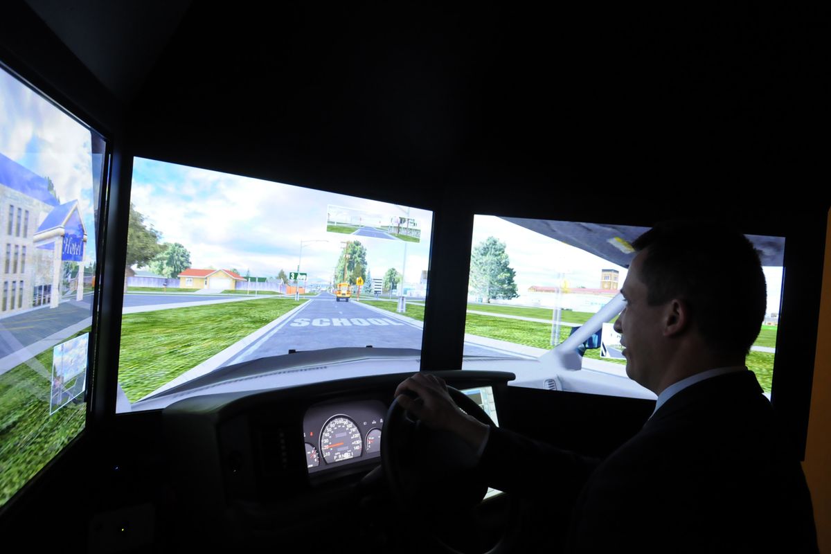 Hans Van Dongen sits in front of a driving simulator that is used to train professional drivers, but which he uses to test subjects of his sleep research projects at the Washington State University Spokane Sleep and Performance Research Center. (Jesse Tinsley)