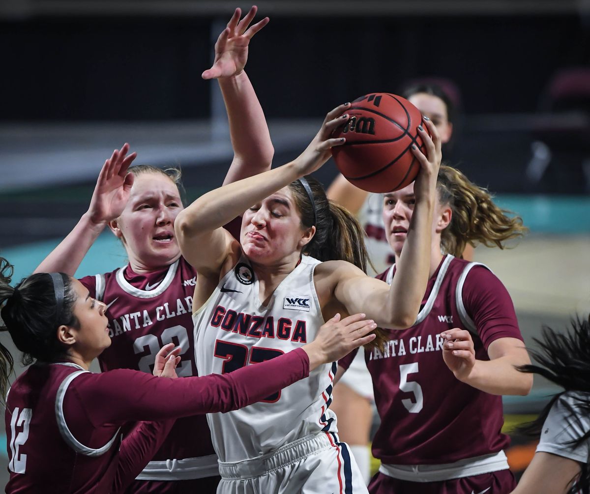 Gonzaga forward Melody Kempton (33) is triple teamed by Santa Clara guard Ashlee Maldonado (12), forward Ashlyn Herlihy (22) and forward Merle Wiehl (5) during the second half of a West Coast Conference semifinal NCAA college basketball game, Monday, March 8, 2021, at the Orleans Arena in Las Vegas.  (COLIN MULVANY/THE SPOKESMAN-REVIEW)