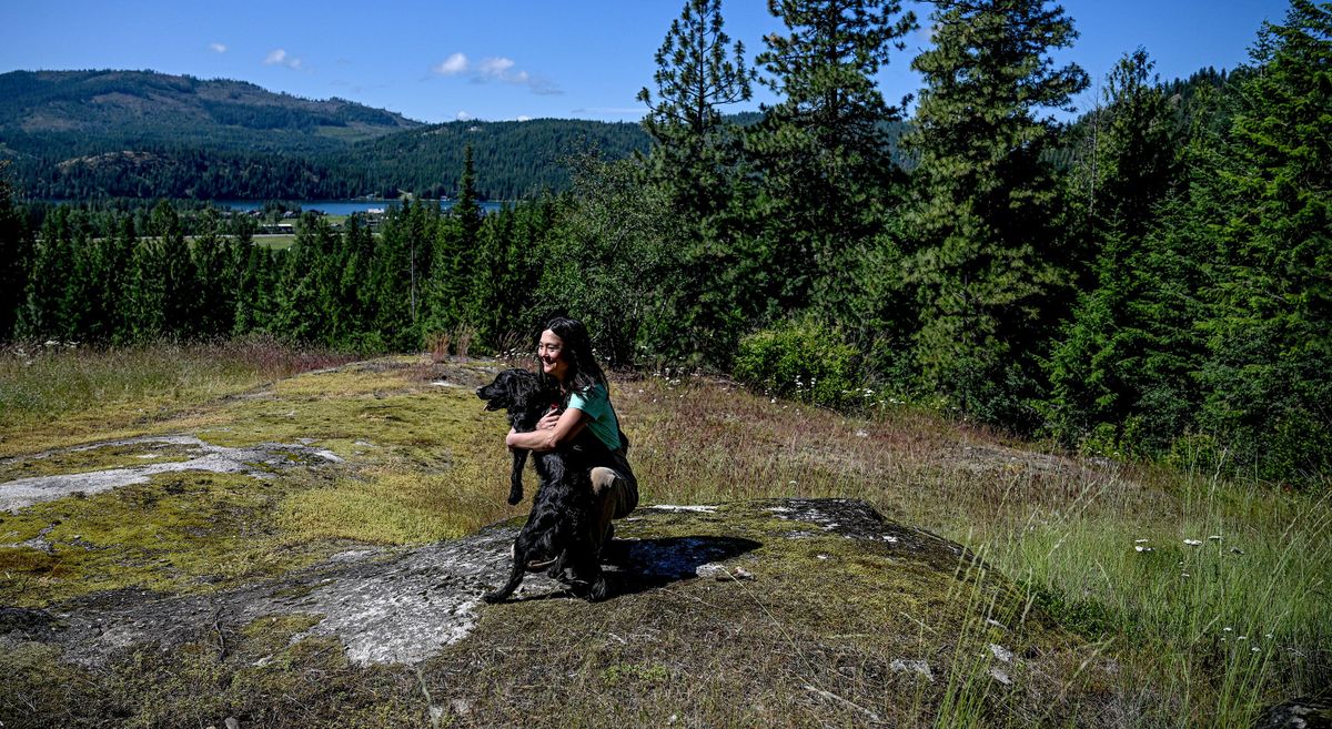 “He gets me out of bed in the morning to feed him so I feed me,” said Jenny Faulhaber about her dog, Larry, during a hike along the trail that will be dedicated to her late husband, Aaron Faulhaber, who died in a boating accident on the Pend Oreille River.  (Kathy Plonka/The Spokesman-Review)