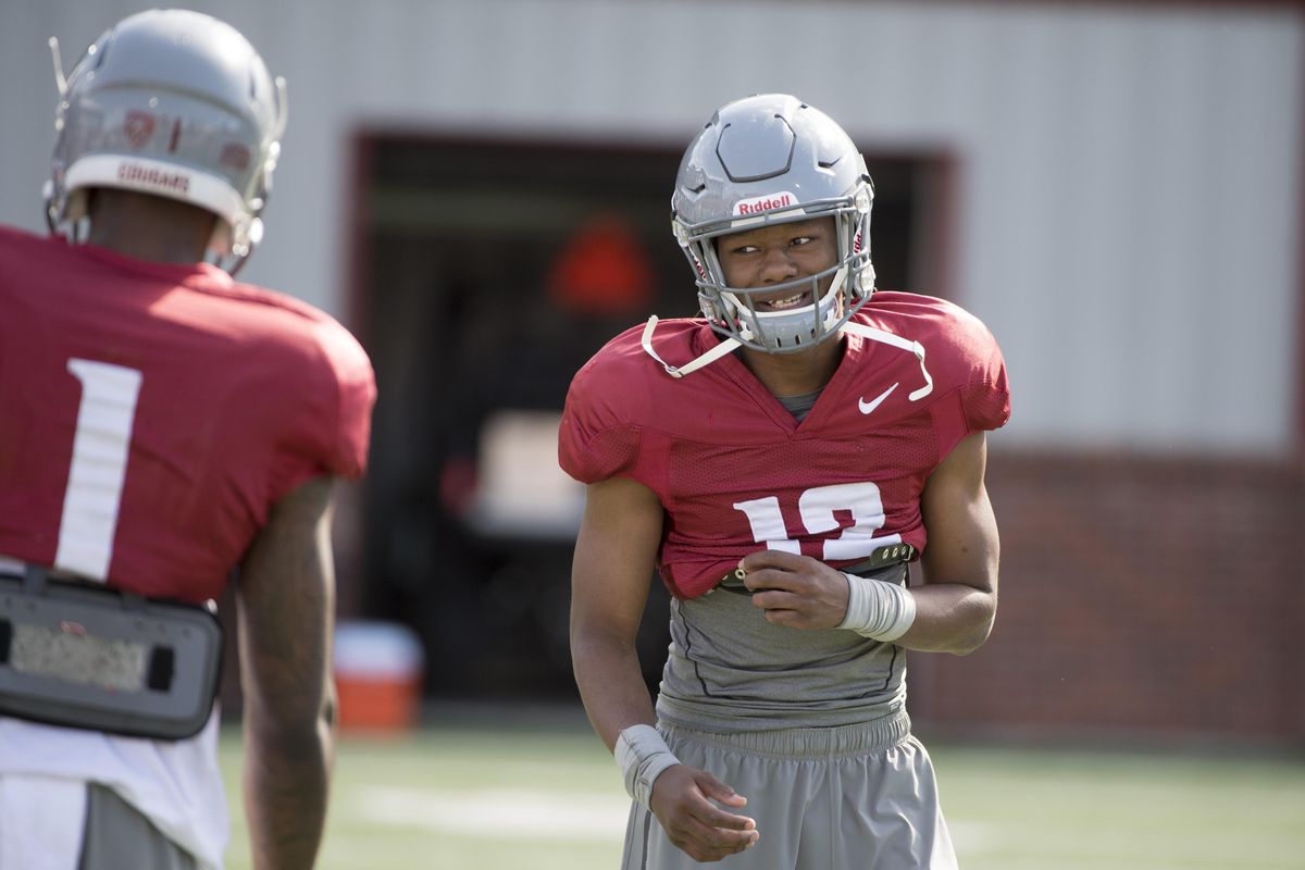 WSU receiver Tavares Martin Jr. (12) laughs with teammates during practice on Thursday, March 31, 2016, at Martin Stadium in Pullman. (Tyler Tjomsland / The Spokesman-Review)