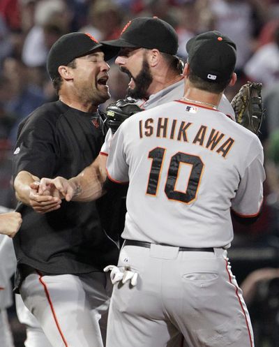 San Francisco pitcher Brian Wilson, center, and Giants teammates celebrate.  (Associated Press)