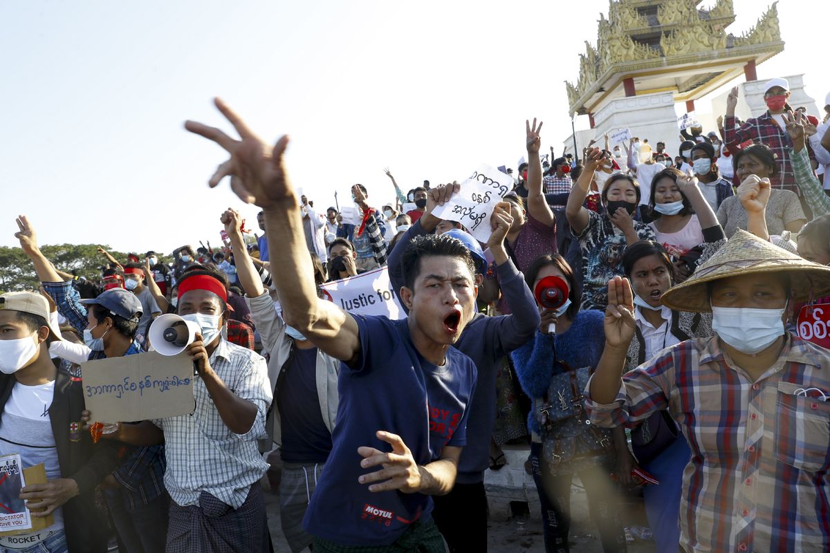 FILE - In this Feb. 10, 2021, file photo, demonstrators flash a three-fingered symbol of resistance against the military coup and shout slogans calling for the release of detained Myanmar leader Aung San Suu Kyi during a protest in Mandalay, Myanmar. When army generals in Myanmar staged a coup last week, they briefly cut internet access in an apparent attempt to stymie protests. Around the world, shutting down the internet has become an increasingly popular tactic by repressive and authoritarian regimes and some illiberal democracies.  (STR)