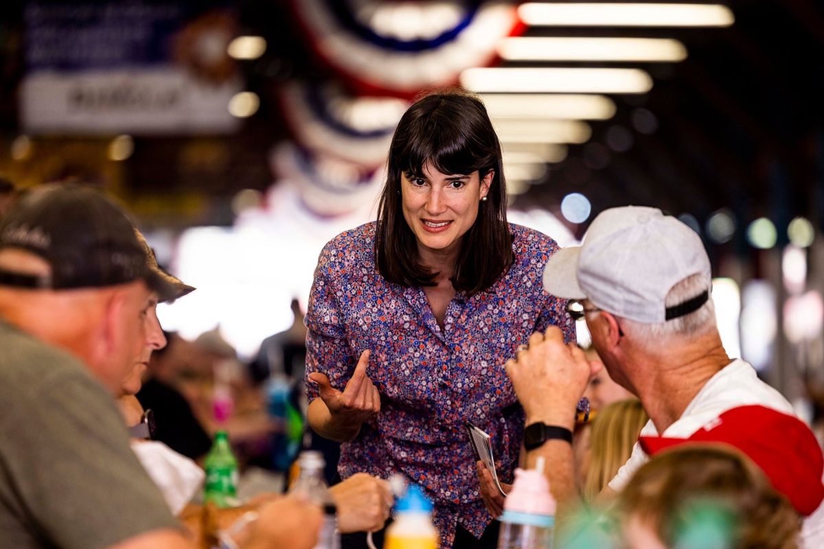 Democrat Marie Gluesenkamp Perez talks to Clark County Fair-goers as they enjoy lunch on Aug. 11, 2022. Gluesenkamp Perez was leading her Republican opponent Joe Kent in the race for Congress representing southweastern Washington in the second day of vote counting.  (Daniel Kim/Seattle Times)