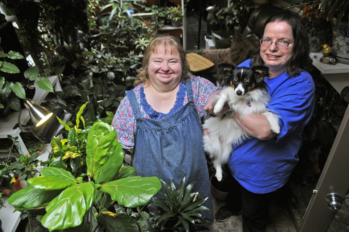 Sisters ViAnn Meyer and Chris Sheppard, shown with Ozzie, are preparing for the Spokane Garden Expo Saturday at Spokane Community College Lair. (Dan Pelle)