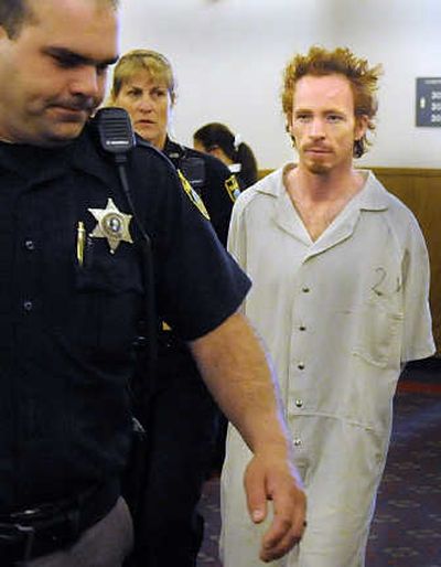 
Jonathan Lytle is escorted into the courtroom of Superior Court Judge Michael Price on Friday. 
 (Christopher Anderson / The Spokesman-Review)