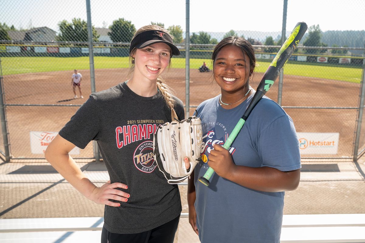 Pitcher Autumn Hibbs, left, and infielder Maliyah Mann are important parts of the University Titans slowpitch squad.  (Jesse Tinsley/THE SPOKESMAN-REVI)
