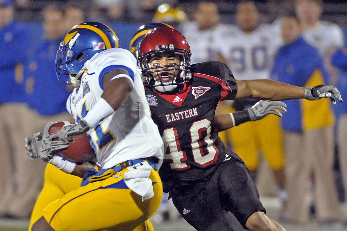 Shadle Park graduate Bo Schuetzle saw action during EWU’s January 2010 FCS title game against Delaware, here beating the block to tackle Phillip Thaxton. (File)