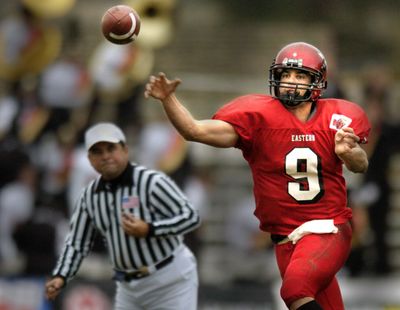 Eastern Washington quarterback Erik Meyer runs toward receiver Eric Kimble as they walk off the field at Carbondale, Illinois, with a 35-31 win over Southern Illinois.  (Spokesman-Review Photo Archives)