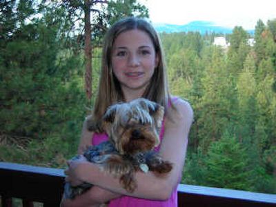 
Lucy Koth holds her dog Clancy. Veterans recently presented Lucy with a first-place award for her Veterans of Foreign War essay 