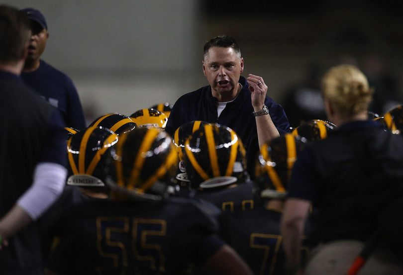 FILE – Bellevue's former Head Coach Butch Goncharoff encourages his team to focus during a time out at the class 3A state football title game between Bellevue High School and Eastside Catholic High School at the Tacoma Dome, Friday, December 4, 2015. Goncharoff was fired from his coaching position in 2016 after a report that detailed rule violations in the school’s football program. (Sy Bean / The Seattle Times)