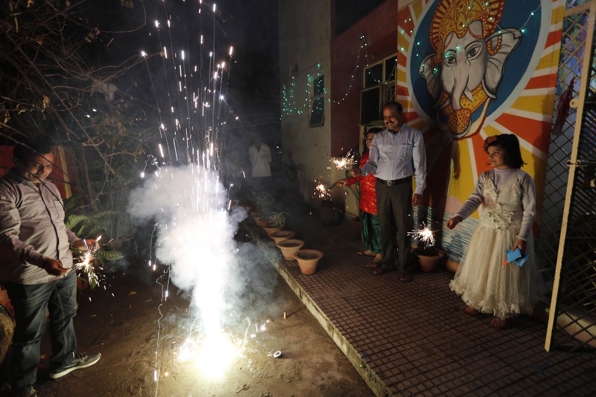 People play with fireworks during Diwali, the Hindu festival of lights, Saturday in Prayagraj, India.  (Rajesh Kumar Singh)