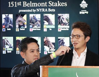 A translator, left, hold the microphone for Master Fencer trainer Koichi Tsunoda as he answers questions during a press conference following the draw ceremony for the 2019 Belmont Stakes race, Tuesday, June 4, 2019, in New York. (Kathy Willens / Associated Press)