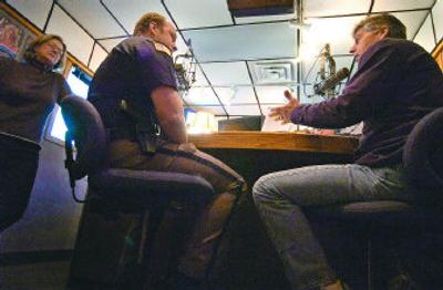 
Mark Fuhrman, right, called Spokane Valley a dictatorship Monday when Sheriff Ozzie Knezovich appeared on his radio show. At far left is producer Rebecca Mack. 
 (Christopher Anderson / The Spokesman-Review)
