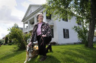 
Eileen Murphy's historic home at the corner of Shannon and Belt in Spokane, will have its metal siding removed by Spokane Preservation Advocates. She shares the 103-year-old home with her dog, Bunny. 
 (Dan Pelle / The Spokesman-Review)