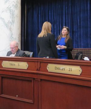Rep. Heather Scott, R-Blanchard, right, talks with Rep. Caroline Nilsson Troy, R-Genesee, on the floor of the House on Thursday morning  (Betsy Z. Russell)
