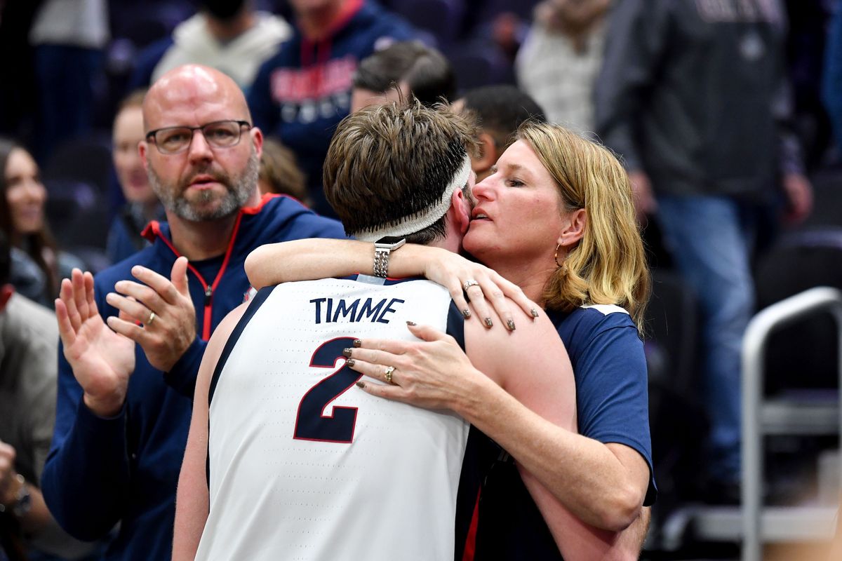 Gonzaga Bulldogs forward Drew Timme (2) embraces his mother Megan Timme after falling to the Alabama Crimson Tide during the second half of a college basketball game on Saturday, Dec 4, 2021, at Climate Pledge Arena in Seattle, Wash. Alabama won the game 91-82.  (Tyler Tjomsland / The Spokesman-Review)