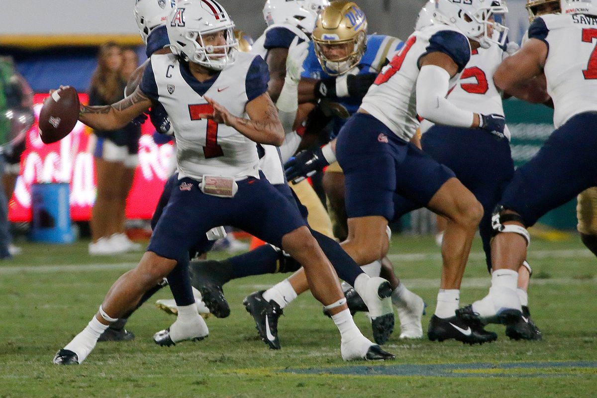 Arizona quarterback Jayden de Laura throws a sideline pass against UCLA during the first half last Saturday in Pasadena, Calif.  (Luis Sinco)