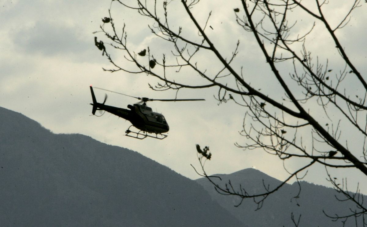 A California Highway Patrol helicopter heads out Wednesday to search  areas where articles belonging to  Steve Fossett were found. Associated Press photos (Associated Press photos / The Spokesman-Review)