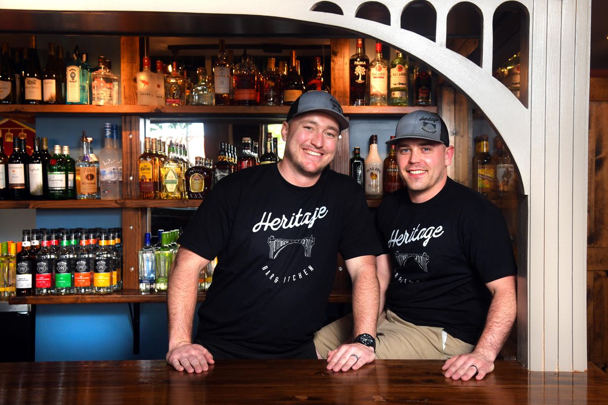 For the past couple of years, Gabe Wood, left, and Alex King have been making plans for their Heritage Bar and Kitchen. A grand opening for the pub-style eatery is slated for June 15. The name is meant to honor Spokane as well as their own family heritage. The logo for Heritage Bar and Kitchen features an image of the Monroe Street Bridge, and the woodwork on the front of the bar is also designed to look like the bridge. (Dan Pelle / The Spokesman-Review)