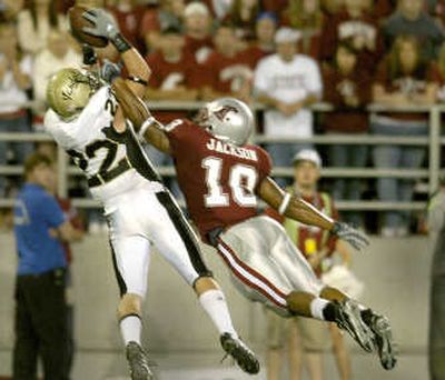 
Idaho wide receiver Max Komar, left, hauls in a touchdown pass in the first half against the defense of WSU's Alfonso Jackson. 
 (Christopher Anderson / The Spokesman-Review)
