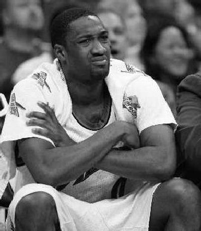 
Wizards guard Gilbert Arenas watches with dismay Sunday. 
 (Associated Press / The Spokesman-Review)