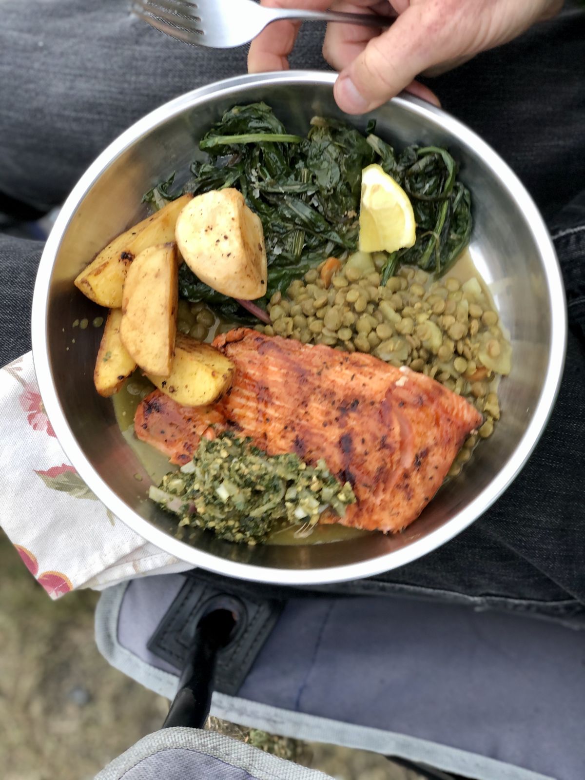 Grilled salmon on curried lentils is a hit by the campfire. (Leslie Kelly)