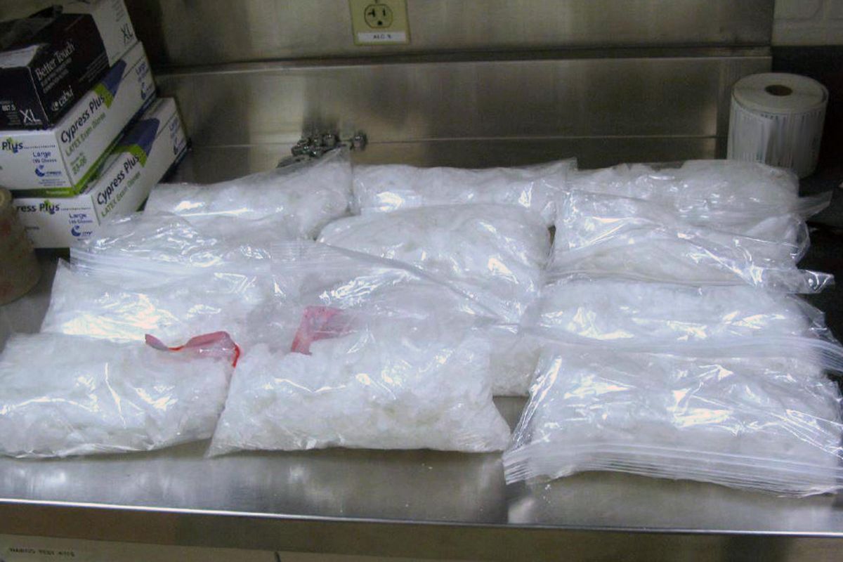 This undated photo provided by the U.S. Border Patrol shows 12 packages of methamphetamine that were confiscated from a U.S. citizen after a border patrol agent spotted a remote-controlled drone swooping over the border fence Tuesday, Aug. 8, 2017 at a border crossing near San Diego, Calif. Authorities have arrested a man they say used the drone to fly drugs across the Mexican border into California. (U.S. Border Patrol)