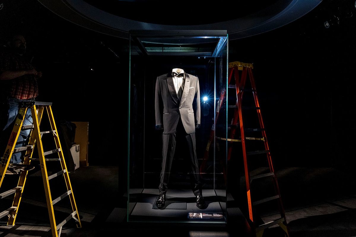 A tuxedo worn by Daniel Craig in “No Time to Die” is displayed in the new exhibit, “007 Science: Inventing the World of James Bond,” at the Museum of Science and Industry.  (Brian Cassella/Chicago Tribune/TNS)