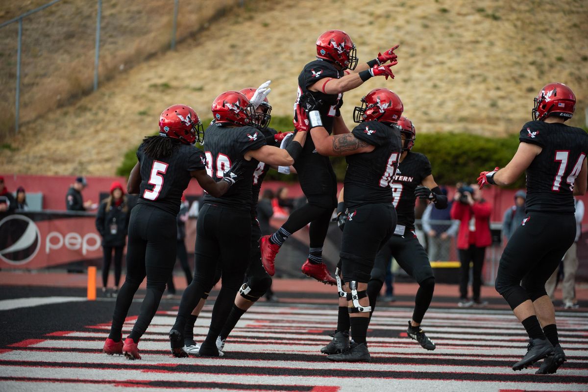 Eastern Washington running back Sam McPherson, in air, celebrates scoring the first touchdown of the game against Southern Utah at Roos Field on Saturday. (Libby Kamrowski / The Spokesman-Review)