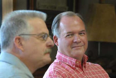 
Auctioneer Randy Wells, left, and Gary Schneidmiller of Coldwell Banker/Schneid- miller Realty, talk about their alliance to offer periodic real estate auctions where groups of properties will be auctioned at the same time. 
 (Jesse Tinsley / The Spokesman-Review)