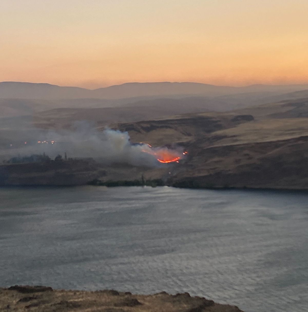 The Vantage Highway fire burns on the west bank of the Columbia River in Vantage, Wash., seen Monday night from Interstate 90 in George, Wash.  (Mathew Callaghan/The Spokesman-Review)