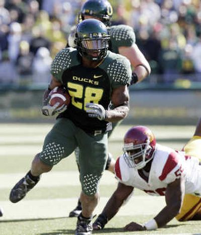 
Oregon's Jonathan Stewart, ran for 105 yards and two touchdowns.Associated Press
 (Associated Press / The Spokesman-Review)