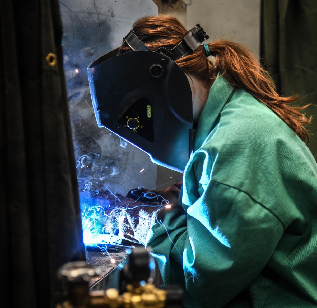 Olivia Perkins demonstrates her welding skills during a class at Shadle Park High School on Friday, Feb. 7, 2020. Thanks to a state program focused on career and technical education, Perkins has received a scholarship to attend Spokane Community College. (Dan Pelle / The Spokesman-Review)