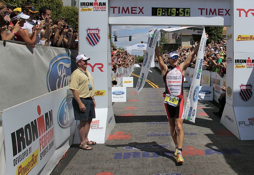 Craig Alexander celebrates at the finish line of the 2011 Ford Ironman Coeur d'Alene Sunday afternoon in downtown Coeur d'Alene. Alexander set a new course record of 8:19:48. Bruce Twitchell/ Special to The Spokesman-Review