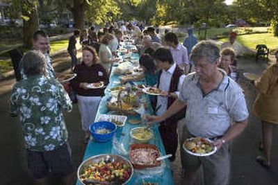
Good neighbors and good food fill the 1100 block of West Ninth Avenue in Spokane on Tuesday evening as part of the National Night Out Against Crime. Parties took place throughout the city. 
 (Christopher Anderson / The Spokesman-Review)