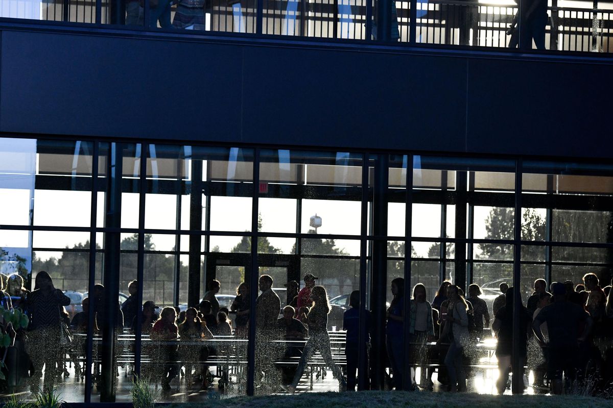 Community members mingle during Selkirk Middle School’s opening on Thursday, Aug. 22, 2019, at 1409 N. Harvest Parkway in Liberty Lake, Wash. (Tyler Tjomsland / The Spokesman-Review)