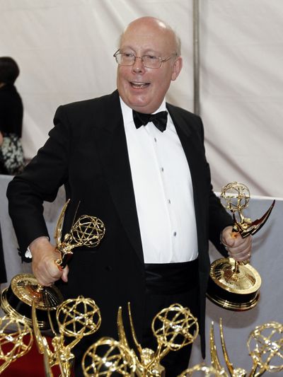 “Downton Abbey” creator Julian Fellowes is seen Sept. 18, 2011, with an Emmy for outstanding mini series. (Associated Press)