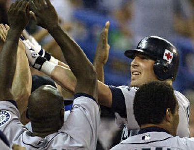 
Richie Sexson congratulated on game-winning grand slam. 
 (Associated Press / The Spokesman-Review)