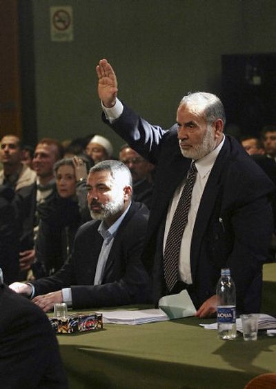 
Hamas leader and lawmaker Ahmed Bahar, right, proposes himself for election of the deputy speaker during the first session of the new Palestinian parliament Saturday.
 (Associated Press / The Spokesman-Review)