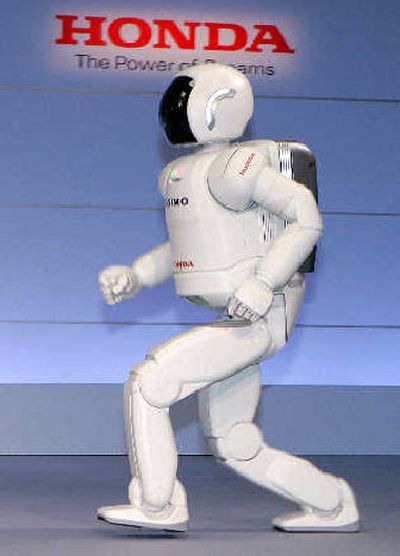 
Honda Motor Co.'s new humanoid robot ASIMO goes through its paces. 
 (Associated Press / The Spokesman-Review)