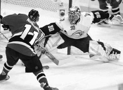 Ottawa captain Daniel Alfredsson slips the puck past straining Buffalo goaltender Ryan Miller to give Senators a win. 
 (Associated Press / The Spokesman-Review)