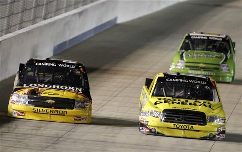 Kyle Busch races Ron Hornaday Jr. and others during the NASCAR Camping World Truck Series Nashville 200. (Photo courtesy of John Sommers II/Getty Images for NASCAR)