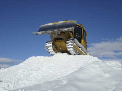 
A guest at Dig This, a Steamboat Springs, Colo., park where people can pay to drive heavy construction equipment for a day, perches atop a bank of snow in a bulldozer Jan. 30. Associated Press
 (Associated Press / The Spokesman-Review)