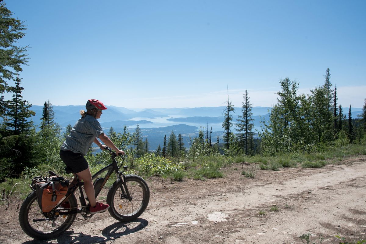 Dani Demmons ride an electrically assisted mountain bike on Monday July 16, 2018. Demmons leads Schweitzer Mountain Resort