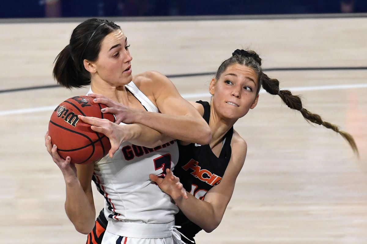 Gonzaga forward Jenn Wirth (3) fends off the defense of Pacific forward Savannah Whitehead (10) during the first half of an NCAA college basketball game, Mon., Jan. 4, 2021, in the McCarthey Athletic Center.  (Colin Mulvany/THE SPOKESMAN-REVIEW)